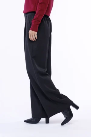 PANTALONE a zampa larga con tasche bottone di chiusura e passanti alla cintura