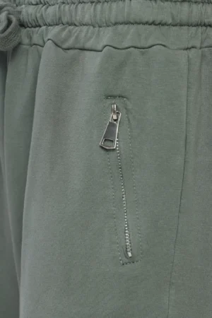 PANTALONE comodo con laccetto di chiusura e tasche con cerniere metalliche ai lati